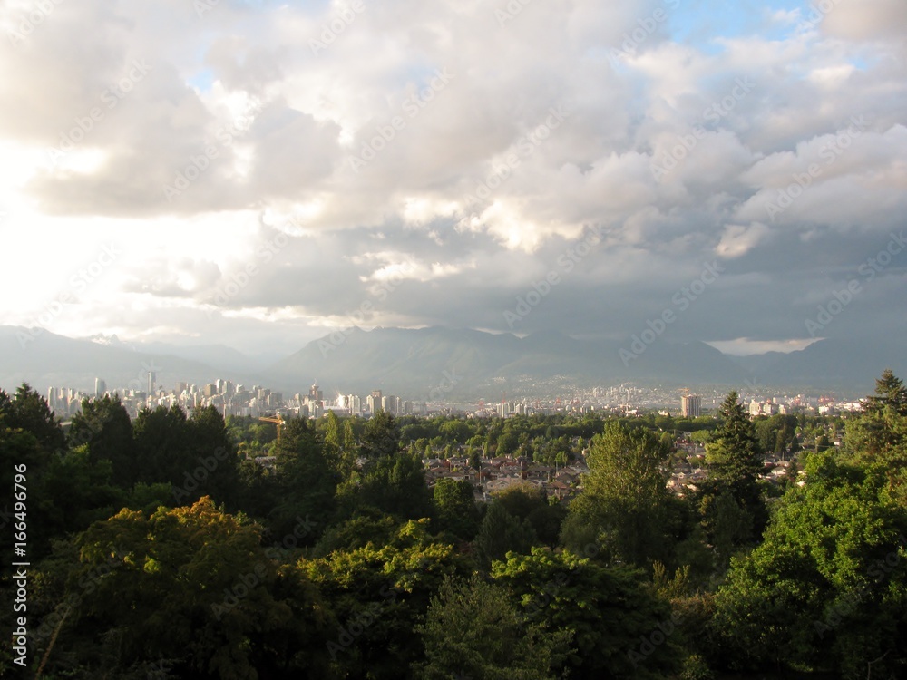 City skyline and mountains panorama on a cloudy day. Vancouver, BC