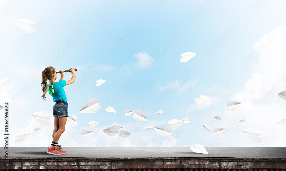 Concept of careless happy childhood with girl exploring this world Concept of careless happy childhood with girl exploring this world