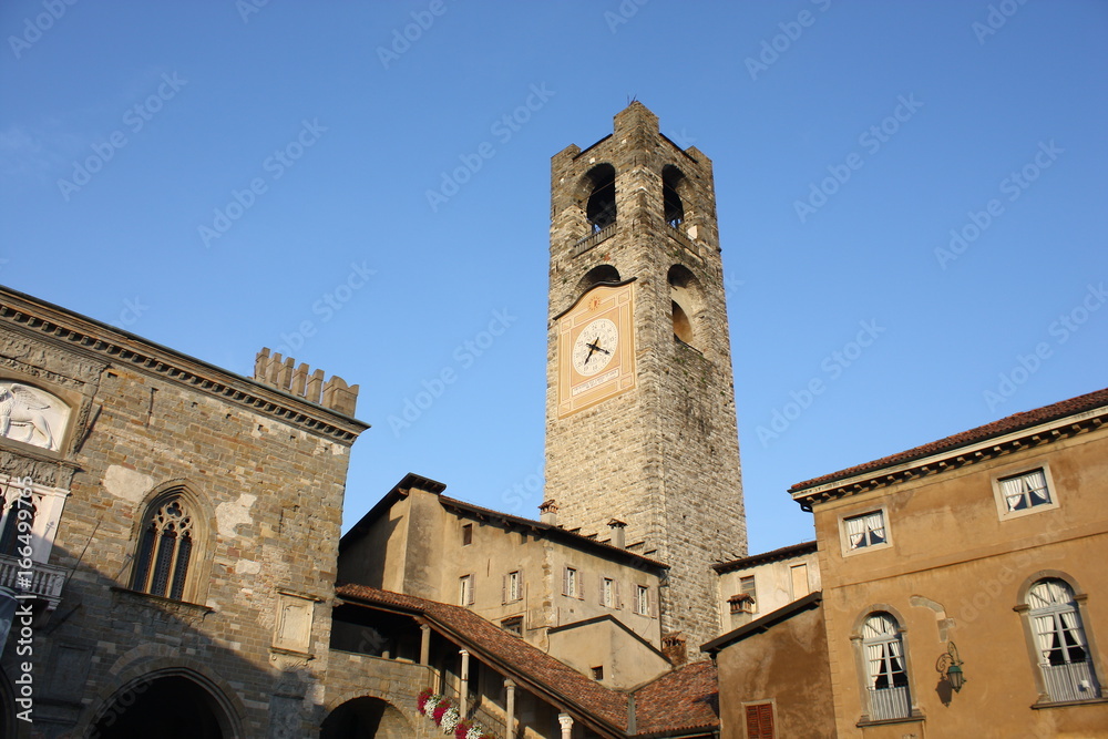 Bergamo - Old city (Città Alta). Landscape on the the ancient Administration Headquarter called Palazzo della Ragione and the clock tower called Il Campanone