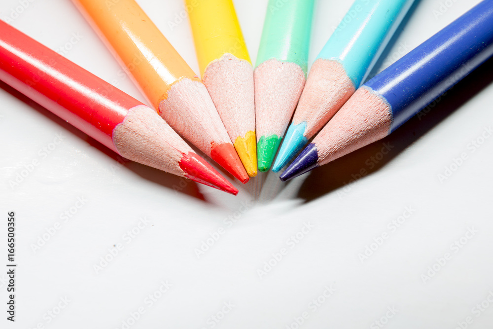 Fototapeta premium Close up of colorful art drawing pencils on white