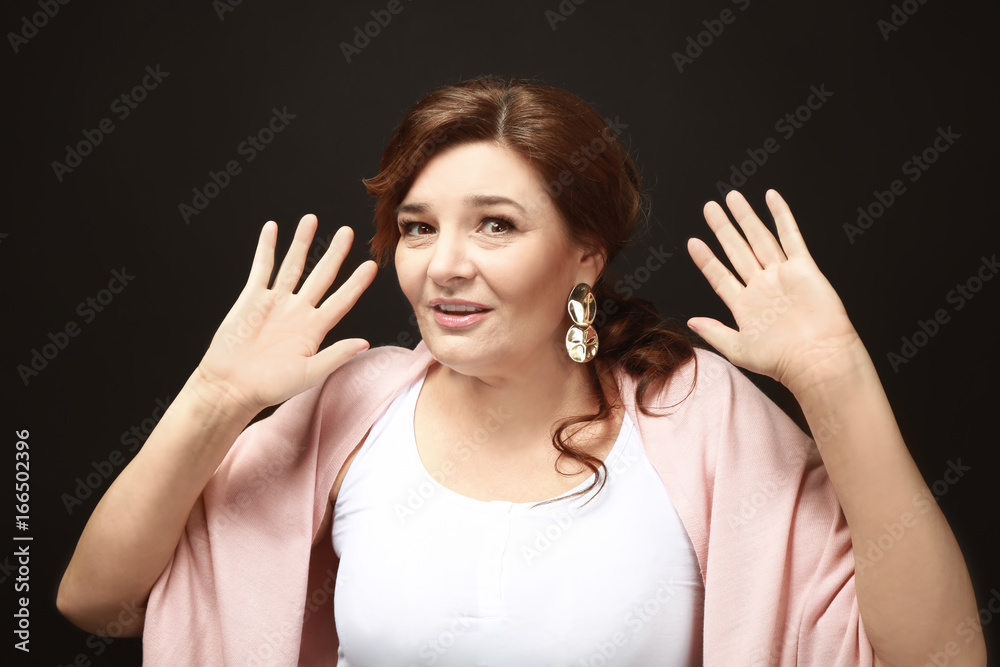 Beautiful elderly woman posing on black background Beautiful elderly woman posing on black background