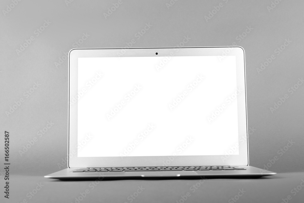 Modern laptop on gray background