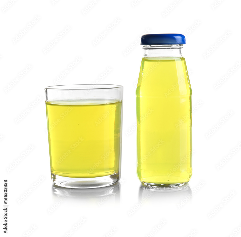 Bottle and glass with delicious juice on white background Bottle and glass with delicious juice on white background