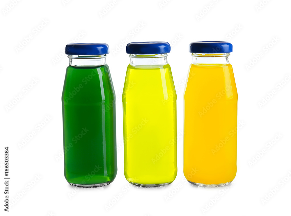 Different juices in bottles on white background Different juices in bottles on white background
