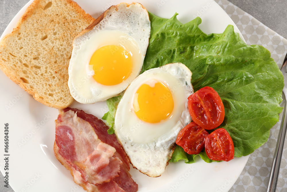 Tasty breakfast with fried eggs on plate Tasty breakfast with fried eggs on plate