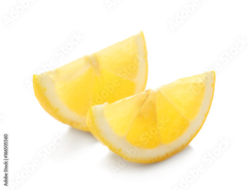 Slices of delicious lemon on white background