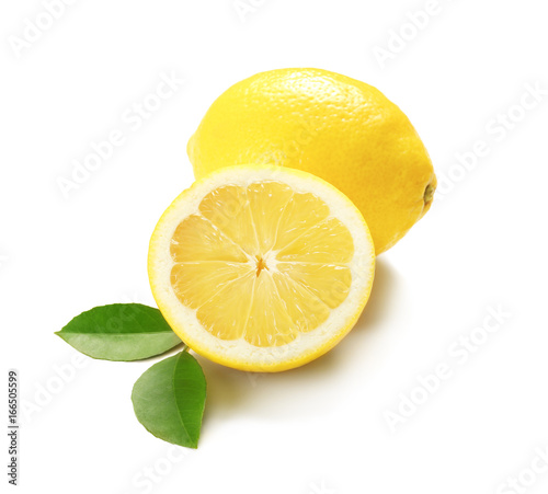 Delicious sliced citrus fruit and green leaves on white background