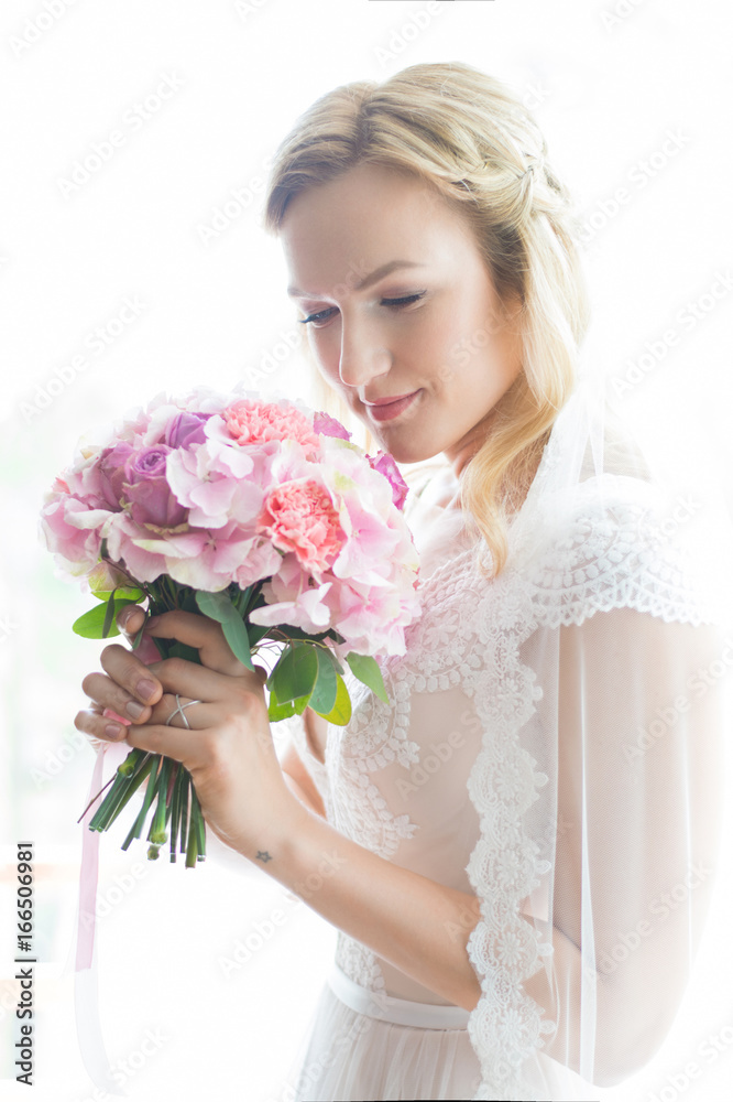 Beautiful bride outdoors in a forest.