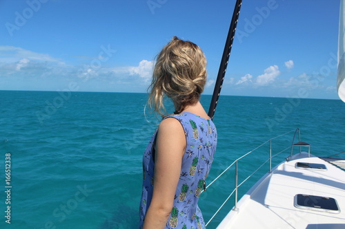 Blonde Woman on Boat Looking at Ocean
