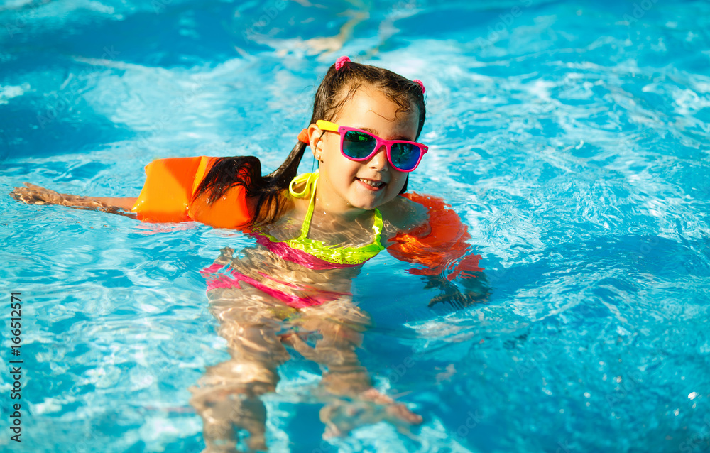 The little girl in the water park swimming underwater and smiling Stock ...
