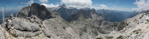 summit of Bavski Gamsovec and Triglav from the summit of Kriz above Kriski podi in national park in Julian Alps in Slovenia