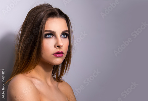 Fashionable portrait of a girl model. Fashion, smoky eyes makeup.