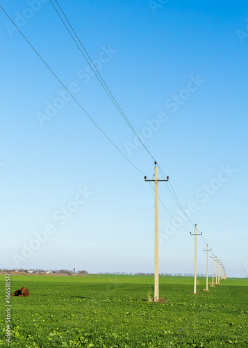 Rural landscape with a field and a power line