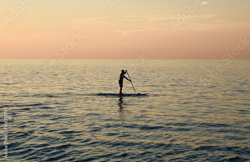 Solitary man SUP stand up paddle boarding © Deborah