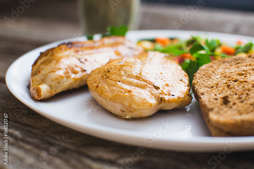 Breakfast on the wooden background from chicken breast