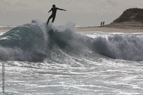 Obraz na płótnie Surfer getting launched into the air from backwash at Margaret River in Western Australia w salonie