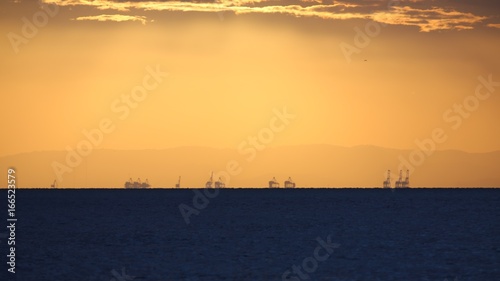 Sunset at the Port of Brisbane from North Stradbroke Island in Queensland Australia