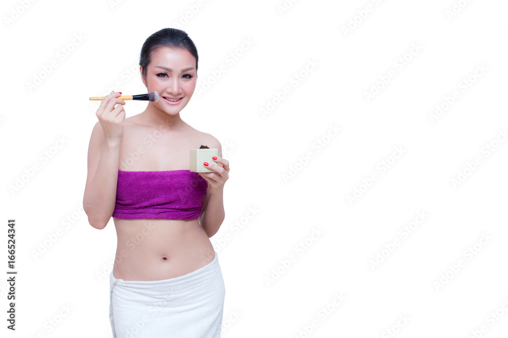 Closeup portrait of a asian woman applying dry cosmetic tonal foundation on the face using makeup brush. Closeup portrait of a asian woman applying dry cosmetic tonal foundation on the face using makeup brush.