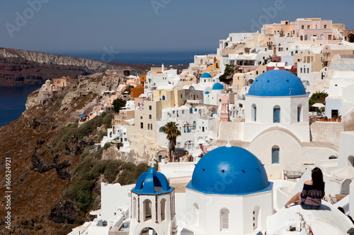Blue roofs of temples on the island of santorini, village of Oia