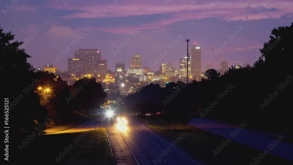 Columbia SC Downtown Exterior Building Lights Cityscape with Highway Traffic during Early Morning Dawn and Fog Over the South Carolina Capitol City Under a Vibrant Colored Sky
