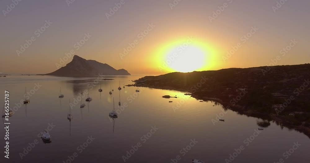 Aerial, beautiful bay in Sardinia with the view on Tavolara island on sunrise, 4K Aerial, beautiful bay in Sardinia with the view on Tavolara island on sunrise, 4K