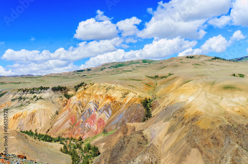 Multicolor soil of mercury occurence in Altai steppe near Kyzyl-Chin photo