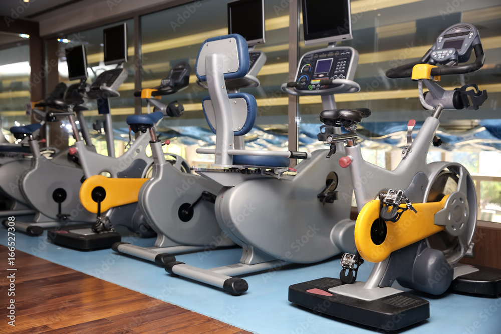Interior of modern gym with machines Interior of modern gym with machines