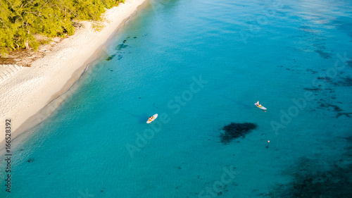 Aerial view of stand up paddleboards near a tropical sandy beach © whitcomberd