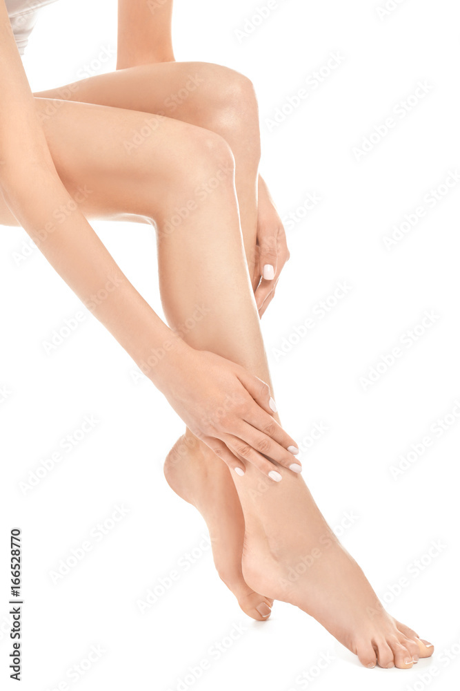 Epilation concept. Legs and hands of beautiful young woman on white background Epilation concept. Legs and hands of beautiful young woman on white background