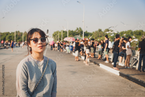 Asian woman portrait with group of people to visit Bang pu seaside, Thailand. © Korradol