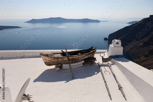 Wooden boat on the roof of the building. Thira (Fira), Santorini Island, Greece