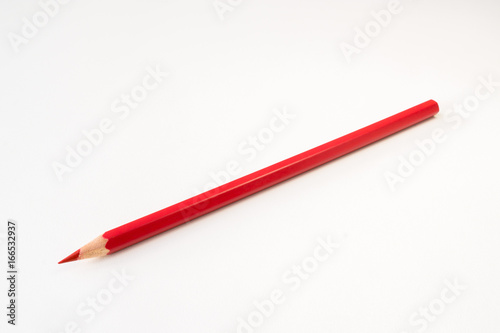 Red color pencil isolated on white background photo