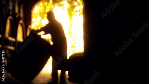 Abstract background footage of vigneron winemaker rolling vintage red or white wine barrel in old winery cellar featuring rows of oak barrels after harvest. Scenes from australian tourism in Barossa V
