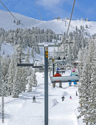 Winter ski lift riders