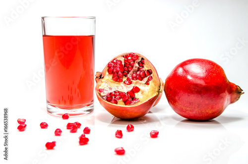 pomepranate juice in glass on white background.Isolated food and drink