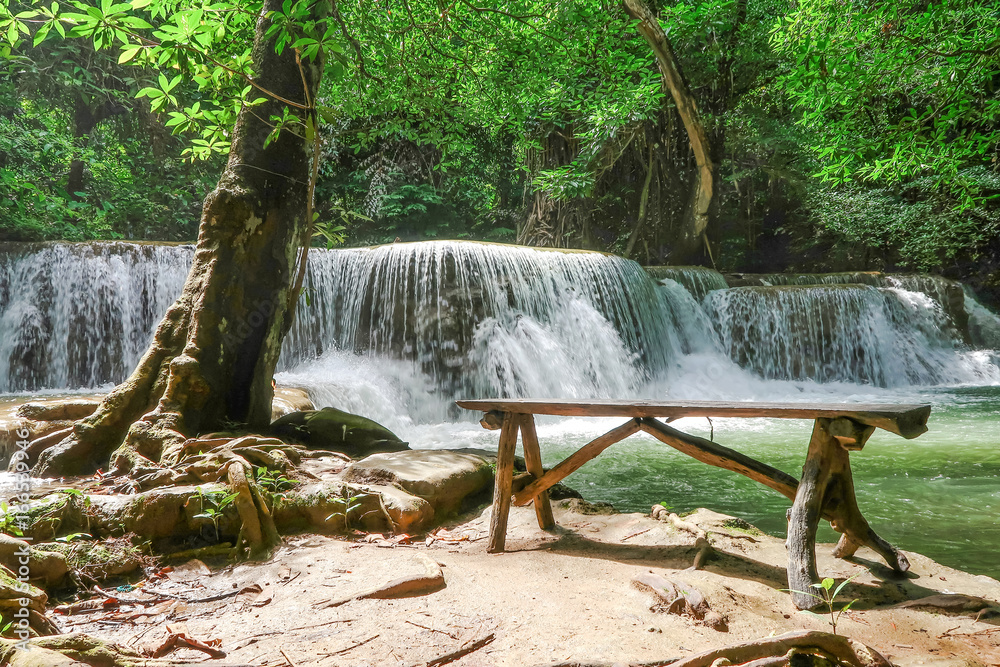 Long wood chair at the side of Huay Mae khamin waterfall in National Park Srinakarin, Kanchanaburi, western of Thailand