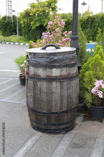 Wood trash bin in the garden.