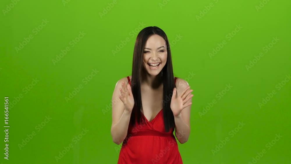 Girl received a big win, she is happy with her victory. Green screen