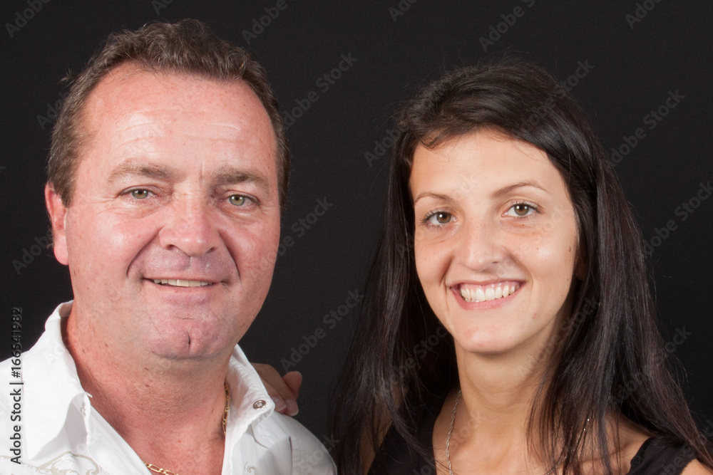 Portrait of smiling woman hugging her father Portrait of smiling woman hugging her father