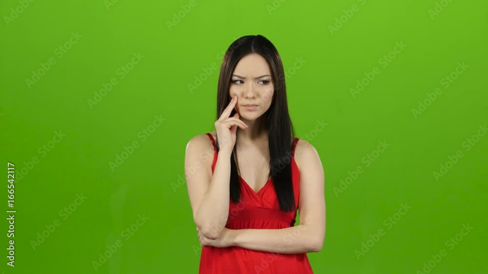 Asian thought about the meaning of life, pensive and focused. Green screen Asian thought about the meaning of life, pensive and focused. Green screen