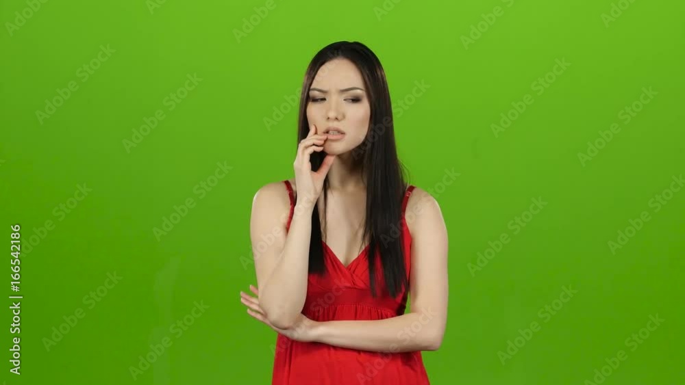 Girl is looking for answers to questions and finds a solution. Green screen Girl is looking for answers to questions and finds a solution. Green screen