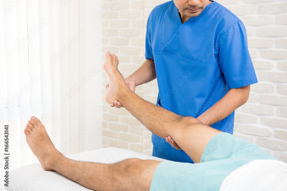 Fototapeta premium Physiotherapist training rehab exercise to broken leg patient