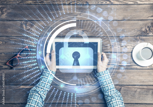 Fotografija Concept of computer access with media lock icon on tablet screen