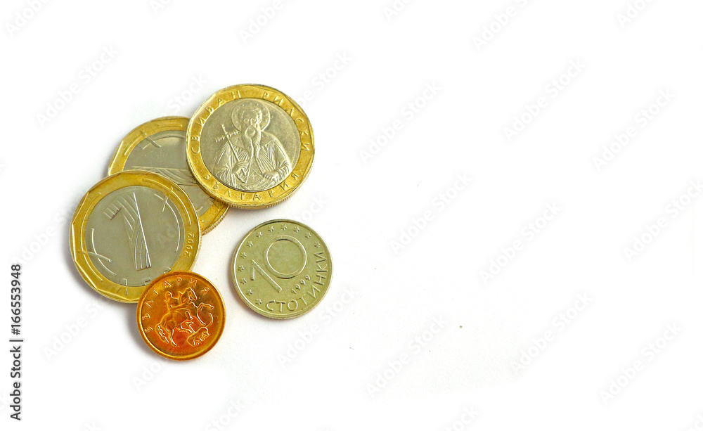 Photo depicts the Bulgarian currency, coins isolated on a white background. 1 leva, BGN, denomination. Portrait of st. Ivan Rylsky. Macro, close up view. Photo depicts the Bulgarian currency, coins isolated on a white background. 1 leva, BGN, denomination. Portrait of st. Ivan Rylsky. Macro, close up view.