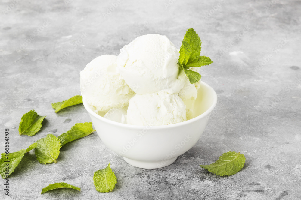 Mint ice cream in bowl on a gray background Mint ice cream in bowl on a gray background