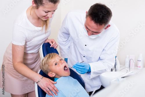 Female with kid are visiting dentist