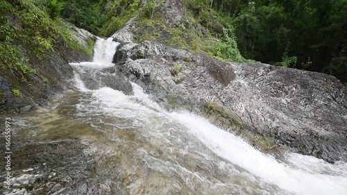 ightseeing waterfall in the forest, north of Thailand photo