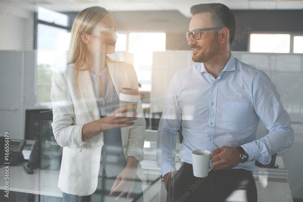 Fototapeta premium Business people standing in office and having break .