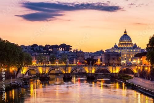 Vatican City, Rome, Italy, Beautiful Vibrant Night image Panorama of St. Peter's Basilica, Ponte St. Angelo and Tiber River at Dusk in Summer. Reflection of The Papal Basilica of St. Peter © daliu