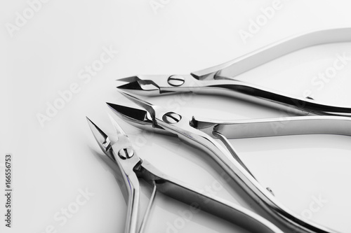 Tools of a manicure scissors on a white background
